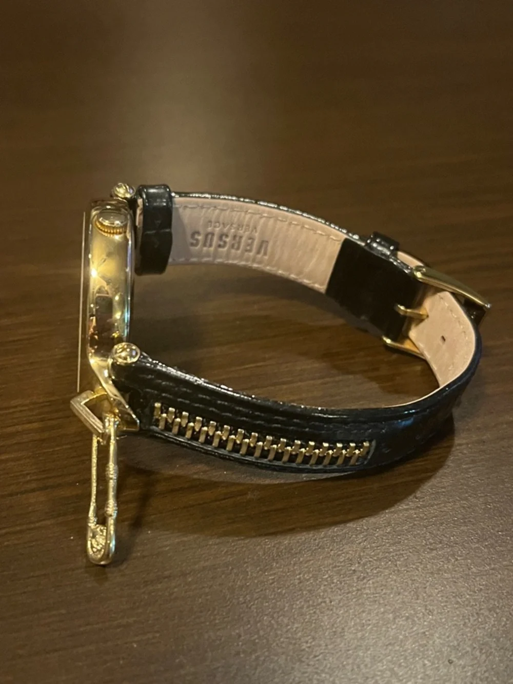 Versus Versace Black and Gold Women's Round Dial Watch with Charm Accent